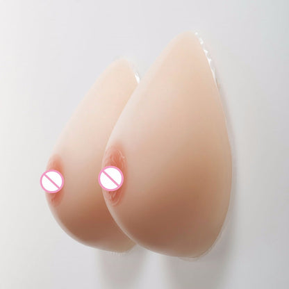 Tette 1000g con reggiseno (3 colori)